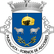 Brasão de Muxagata com castelo dourado, duas cabras, louros cruzados e coroa